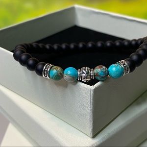 Hand made men’s bead bracelet matte black work a pop of color very minimal